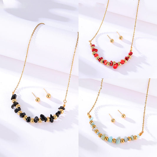 Bohemian-style natural stone and gold bead pendant necklace and earrings set.
