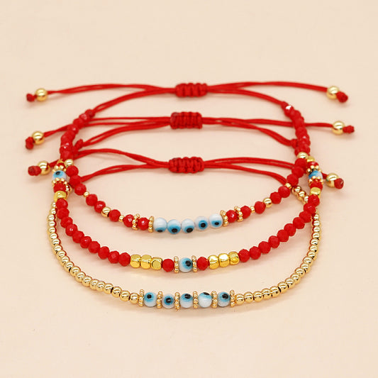 Red Crystal Eye Bracelet with Snowflake Pattern and Glass Beads
